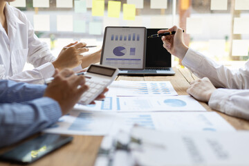 Business meeting, brainstorming sessions discuss analysis of investment growth graph and market...