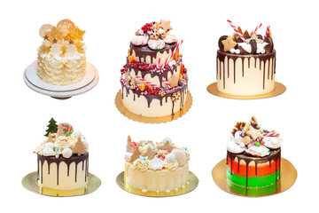 Collection of isolated cakes for christmas and New Year celebrations. With edible christmas trees, dried oranges, candy canes, snowflakes, gingerbread