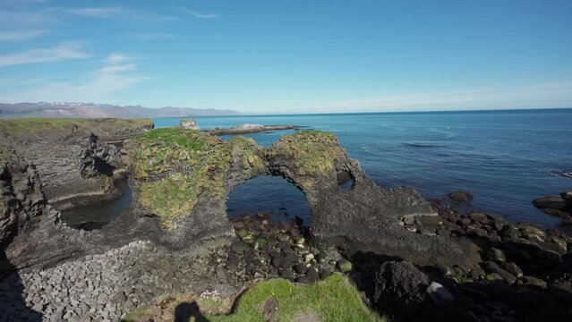 Gatklettur naturally basalt formed rock arch by Atlantic coast in summer on Snaefellsnes peninsula at Arnastapi, Iceland