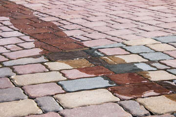Water flows on paving slabs close up