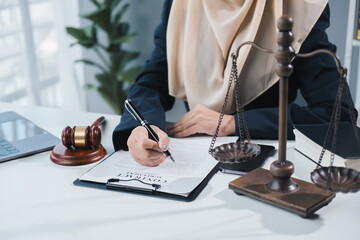 Muslim Lawyers or attorneys discussing a contract agreement. Successful businesswomen have a...