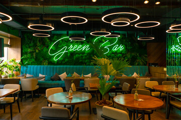 a bright interior of a restaurant or bar a lot of greenery and plants an empty room Asian style