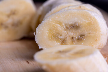 Sliced ripe banana on a cutting board