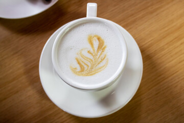 A cup of coffee on a wooden table