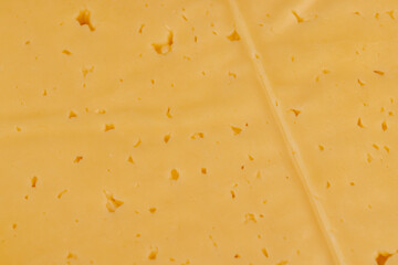 semi- hard cheese with holes cut into chunks