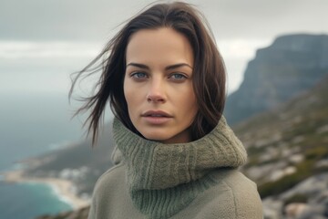 Photography in the style of pensive portraiture of a content girl in her 30s wearing a thermal merino wool top at the table mountain in cape town south africa. With generative AI technology