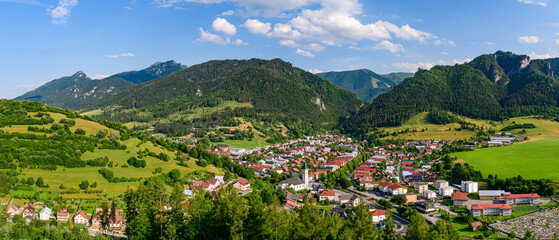Terchova, mountain panorama of Mala Fatra National Park with a small village in the valley. View from the Terchovske srdce lookout tower, a tourist attraction on the hiking trail.