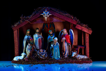 Virgin Mary, Joseph and baby Jesus. Religious scene. Christmas Manger scene with figures of Jesus,...