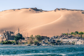 Sand Dunes of Egyptwith the Nile River in the foreground