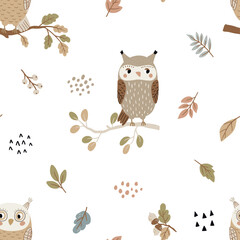 Seamless pattern with owls and autumn leaves on a white background for children's textiles, scrapbooking paper, postcards.