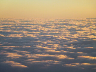 Thick orange evening clouds under a clear sky. Natural landscape