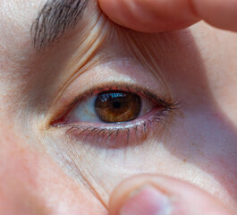 close-up of a human eye, eyelids and eyelashes on a girl's face