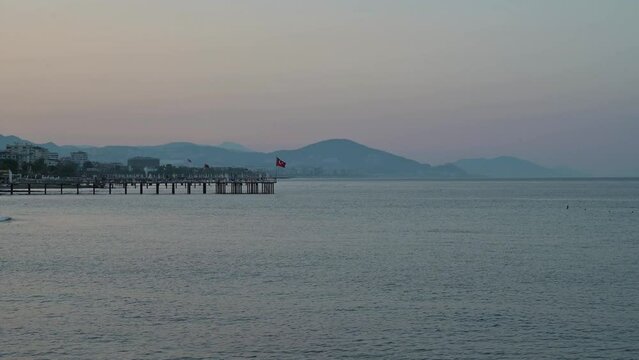 Beautiful sundawn scene on Alanya beach with view to famous Alanya island, in Turkey