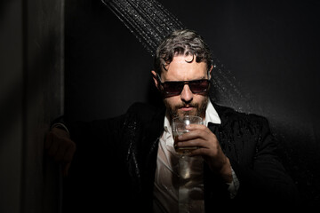 Personality crisis, midlife crisis. Middle age crisis. Sad business man in suit drinking whisky...
