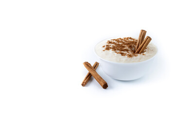 Arroz con leche. Rice pudding with cinnamon in white bowl isoalted on white background. Copy space