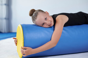 Image of a little girl in the gym. Gymnastics concept.