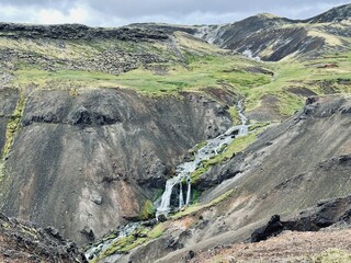 Mossy and wetland terrain of Reykjadalur Valley, Iceland. Valley is known for its mudpots, soda springs and geothermal activity. 