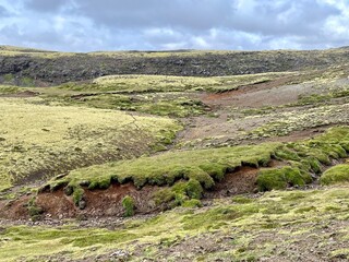 Mossy and wetland terrain of Reykjadalur Valley, Iceland. Valley is known for its mudpots, soda springs and geothermal activity.