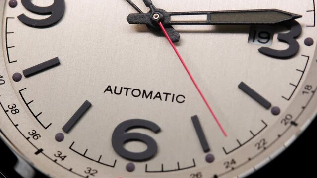 Stylish Luxury Man Wrist Watch With Moving Hand And Multiple Dials. Men's watch in metal with sapphire crystal. Closeup view of rotating watch, running second arrow. Cyclops watch