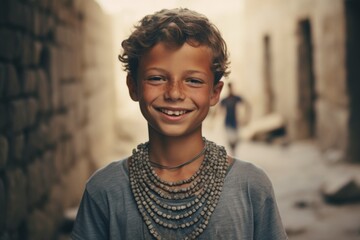 Medium shot portrait photography of a happy boy in his 20s wearing a dramatic choker necklace at the crac des chevaliers in homs governorate syria. With generative AI technology