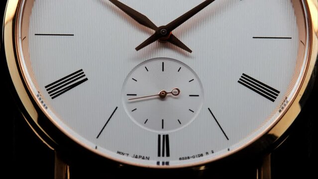 Stylish Luxury Man Wrist Watch With Moving Hand And Multiple Dials. Men's watch in metal with sapphire crystal. Closeup view of rotating watch, running second arrow. Cyclops watch