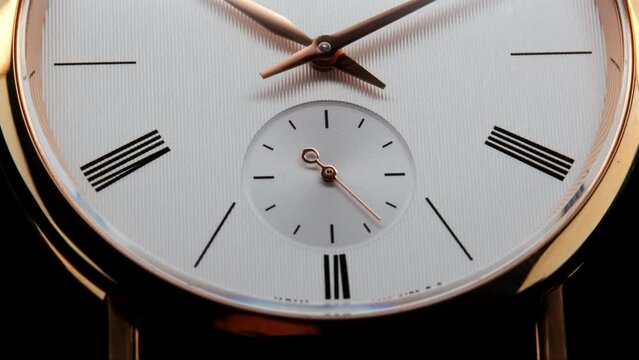 Stylish Luxury Man Wrist Watch With Moving Hand And Multiple Dials. Men's watch in metal with sapphire crystal. Closeup view of rotating watch, running second arrow. Cyclops watch