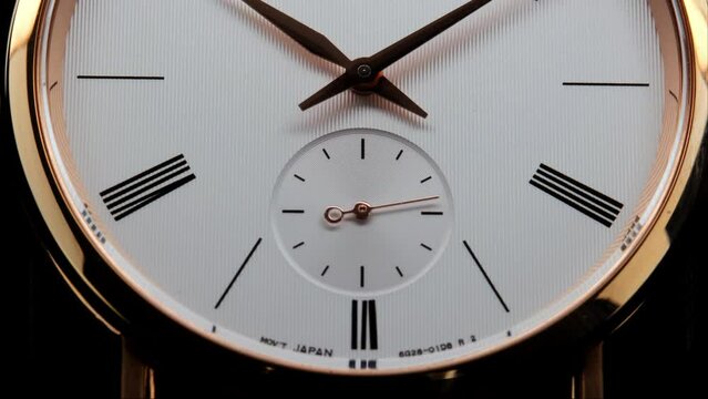 Stylish Luxury Man Wrist Watch With Moving Hand And Multiple Dials. Men's watch in metal with sapphire crystal. Closeup view of rotating watch, running second arrow. Cyclops watch