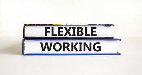 Flexible working symbol. Concept words Flexible working on beautiful books. Beautiful white table white background. Business flexible working concept. Copy space.