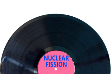 Nuclear fission symbol. Concept words Nuclear fission on beautiful black vinyl disk. Beautiful...