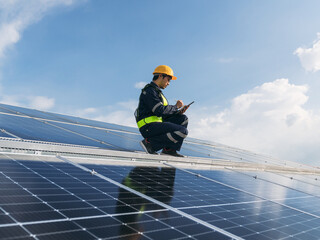 Service engineer checking solar cell on the roof for maintenance if there is a damaged part. Engineer worker install solar panel. Clean energy concept.