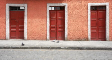 Fototapeta na wymiar Street view of an old colonial building facade, Cuenca, Ecuador.