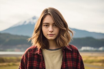 Medium shot portrait photography of a glad girl in her 20s wearing a comfy flannel shirt near the mount fuji in honshu island japan. With generative AI technology