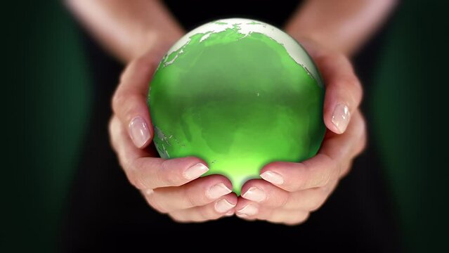 Female Hands Holding Green Planet Earth. Environment Conservation, Save Clean Planet and Ecology, Sustainable Lifestyle. World Earth Day. Loopable from frame 35 to frame 484.
