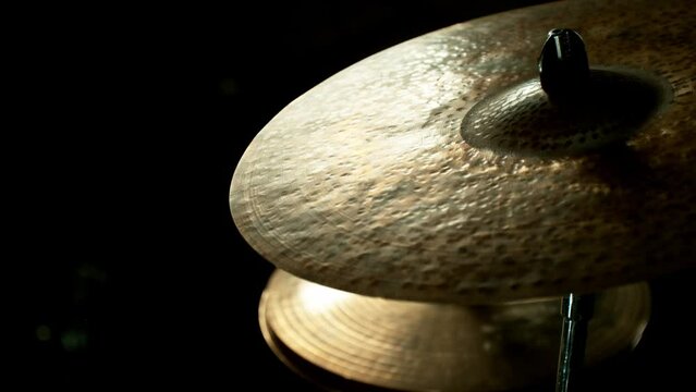 Close-up of a drummer plays on a cymbal in the fog. Super slow motion filmed on high speed cinema camera at 1000 fps.
