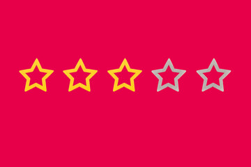 Gold, gray, silver five star shape on a red background.  Concept image of setting a five star goal....