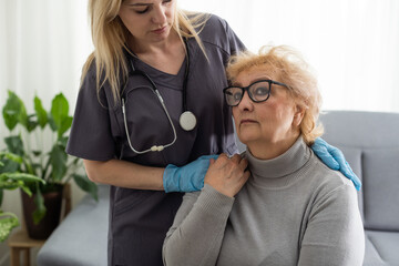 Health visitor and a senior woman during home visit