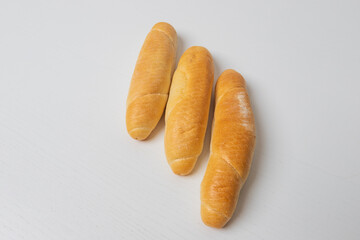 White pastry roll on a white table background.