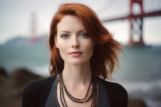 Environmental Portrait Photography Of A Tender Girl In Her 30s Wearing A Chic Pearl Necklace At The Golden Gate Bridge In San Francisco Usa. With Generative AI Technology