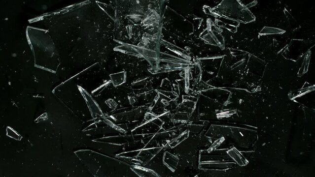 Super Slow Motion Shot of Breaking Real Glass at 1000 fps. Isolated on Black Background.