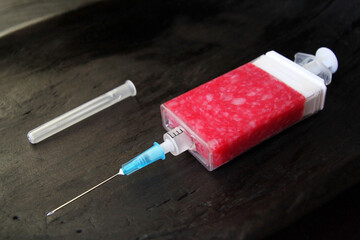 Concept, food of the future. Symbiosis of medicine and cooking. Imitation of a medical syringe...