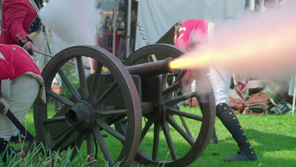 Historic blast of ancient Cannon explosion, soldiers firing an authentic antique historical weapon