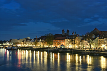 Fototapeta na wymiar Beautiful old buildings and Danube river at night in Regensburg Germany