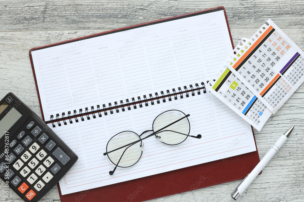 Poster blank notepad for layout or background for information or text. calculator and calendar
