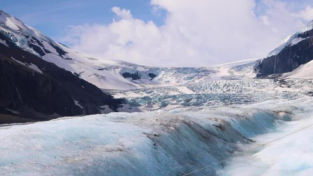 Views of the valleys, snow capped mountains, blue glaciers, and dense green pine forests in the Rocky Mountains, from the Columbia Ice fields, Alberta, Canada. Jasper National Park. 