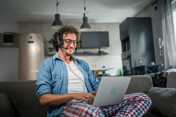One man caucasian male freelancer work from home on laptop computer