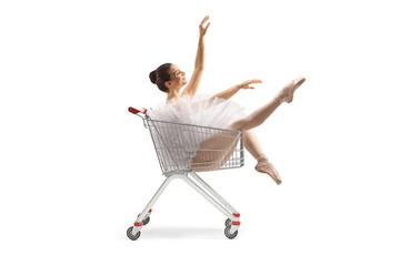 Ballering in a tutu dress sitting inside a shopping cart