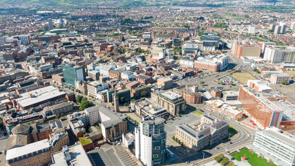 Fototapeta na wymiar Aerial view on buildings and Lagan River in City center of Belfast Northern Ireland. Drone photo, high angle view of town