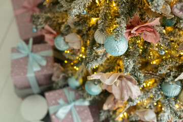 Many beautiful gift boxes under Christmas tree