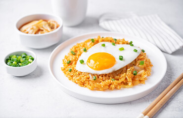 Kimchi fried rice with fried egg and scallion sprinkle