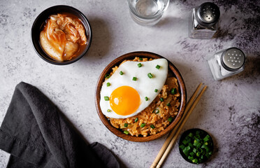 Kimchi fried rice with fried egg and scallion sprinkle